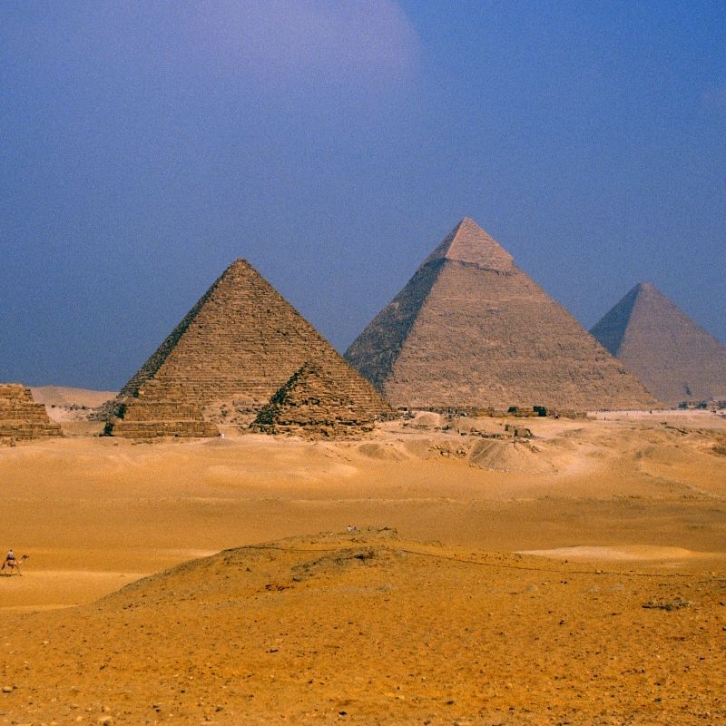 The iconic Pyramids of Giza in Egypt rise majestically from the desert sands, captured in this breathtaking travel photograph. These ancient monuments, including the Great Pyramid of Khufu, reflect the engineering genius and cultural significance of one of the world’s oldest civilizations. Set against the vast Egyptian desert and often bathed in golden sunlight, the pyramids continue to inspire awe and symbolize humanity’s enduring quest for legacy and knowledge. Ideal for history enthusiasts, culture lovers, and photographers, visiting Giza offers an unforgettable journey through ancient architecture, archaeology, and timeless heritage. Inspiration Africa specializes in bespoke, tailor-made journeys to Egypt and across Africa, crafting authentic travel experiences that bring legendary monuments and iconic historical sites to life.