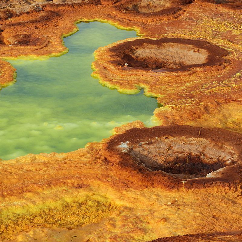 Ethiopia’s Danakil Depression is one of the hottest and lowest places on Earth, featuring dramatic landscapes with salt flats, sulfur springs, and active volcanoes, offering a unique geological experience.
