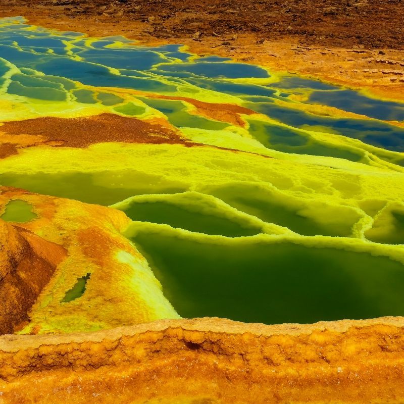 Experience the surreal landscapes of Ethiopia with this striking image of the Danakil Depression, one of the hottest and most otherworldly places on Earth. The photo captures the vivid colors, salt flats, and geothermal formations that make this region so extraordinary, from mineral-rich pools to steaming vents and jagged volcanic terrain. The stark, alien beauty of the Danakil Depression reveals a landscape shaped by extreme geology and climate, offering a truly unique glimpse into nature’s raw creativity.
Inspiration Africa creates tailor-made journeys to Ethiopia, allowing travellers to explore the Danakil Depression safely and responsibly, and to experience one of Africa’s most dramatic and unforgettable geological wonders.