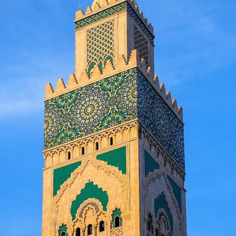 Morocco’s mosques are masterpieces of Islamic architecture, where intricate mosaics, carved plaster, and towering minarets create stunning landmarks. This image captures a minaret adorned with blue mosaics, a signature detail found across Morocco’s spiritual heritage. Must-see mosques include the iconic Hassan II Mosque in Casablanca, the historic Koutoubia Mosque in Marrakech, the centuries-old Al Quaraouiyine Mosque in Fez, and the striking Moulay Idriss Mosque in Moulay Idriss Zerhoun. Inspiration Africa curates tailor-made journeys to Morocco, offering exclusive insights into these sacred spaces and the rich cultural traditions they represent. Explore Morocco’s beauty and spirit with us.