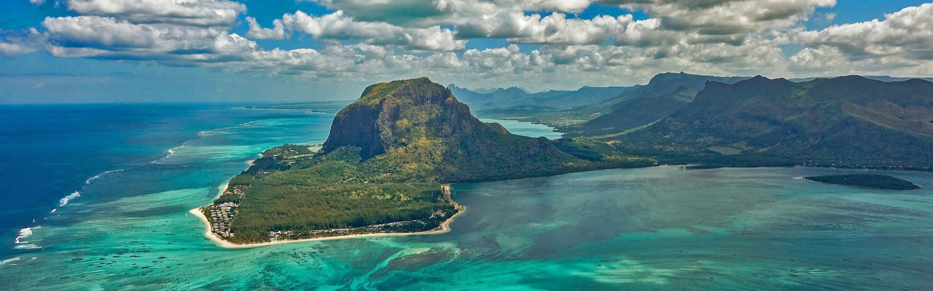 From the air, Le Morne Brabant in Mauritius reveals a breathtaking blend of turquoise lagoons, lush green cliffs, and endless ocean horizons. This UNESCO World Heritage Site is rich in cultural history and natural beauty, offering travelers opportunities for hiking, watersports, and relaxation on pristine beaches. The dramatic landscape, shaped by centuries of wind and waves, is one of the island’s most iconic sights. Inspiration Africa crafts personalized journeys to Le Morne and the surrounding areas, ensuring travelers experience the best of Mauritius' natural wonders, cultural heritage, and unforgettable island adventures in true style and comfort.