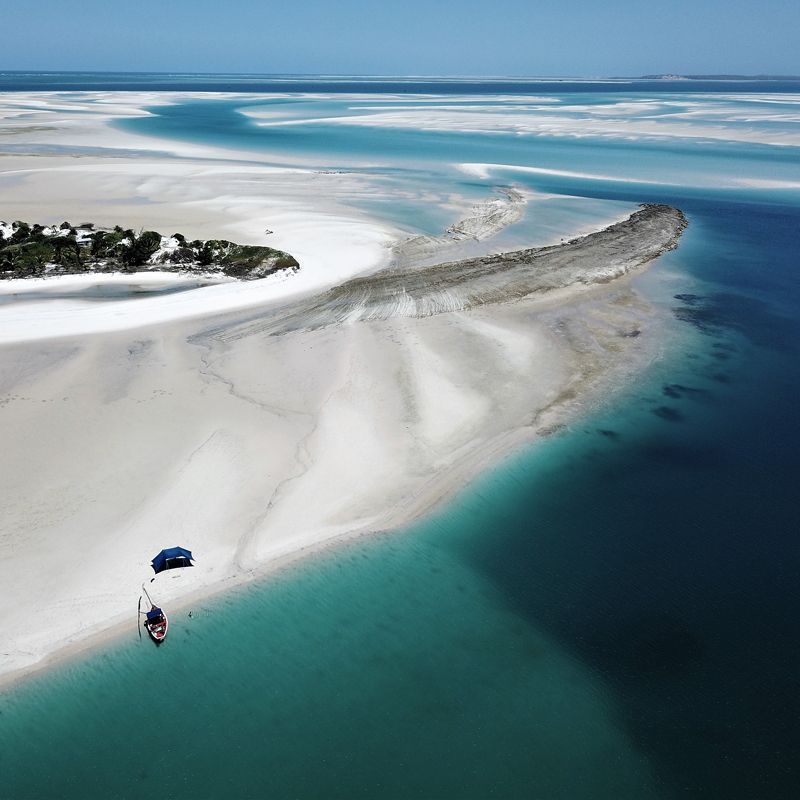 Aerial view of deserted beach surrounded by the turquoise waters off the Mozambique channel.