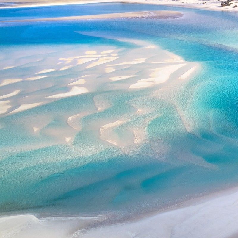 An aerial view showcases the stunning sandbanks and vibrant turquoise waters of the Bazaruto Archipelago in Mozambique, captured in this breathtaking travel photograph. The archipelago is renowned for its pristine beaches, crystal-clear lagoons, and rich marine biodiversity, including coral reefs, dugongs, and tropical fish. From above, the intricate patterns of sandbanks and shallow channels reveal the natural beauty of one of Africa’s most unspoiled coastal destinations. Ideal for adventure seekers, nature lovers, and marine enthusiasts, the Bazaruto Archipelago offers unforgettable experiences including snorkeling, kayaking, and island exploration. Inspiration Africa specializes in bespoke, tailor-made journeys to Mozambique and across Africa, creating authentic, immersive travel experiences in extraordinary destinations.
