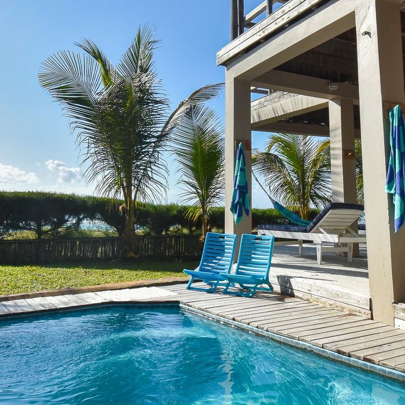 The swimming pool at Corasiida Guest House on Tofo Beach in Mozambique is captured in this inviting travel photograph, showcasing a serene oasis set amid tropical greenery. The pool’s calm waters reflect the surrounding palms and sun loungers, creating a peaceful and relaxed atmosphere for guests. Bright sunlight and open skies enhance the sense of warmth and leisure, while the intimate design of the pool area emphasizes comfort and privacy. The scene conveys tranquility, casual luxury, and a connection to the vibrant coastal environment, highlighting Corasiida Guest House as an ideal retreat for relaxation near the Indian Ocean. Inspiration Africa specializes in bespoke, tailor-made journeys to Mozambique and across Africa, crafting unforgettable travel experiences in extraordinary destinations.
