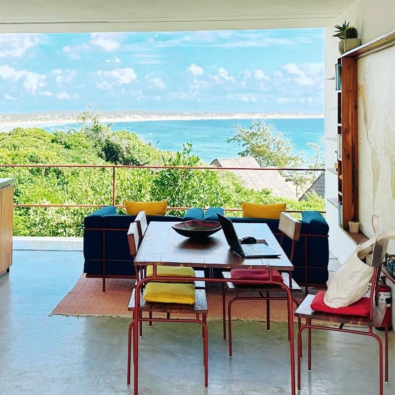 The dining room at Duna Sonambula, Tofo Beach, Mozambique, is captured in this inviting travel photograph, showcasing a space where guests can enjoy meals with panoramic views of the Indian Ocean. Large windows and open sides allow natural light to flood the room while framing the turquoise waters, gently rolling waves, and sandy shoreline beyond. Natural materials, tasteful décor, and simple furnishings create a relaxed yet elegant atmosphere that complements the surrounding coastal environment. The scene conveys serenity, comfort, and connection to the ocean, highlighting Duna Sonambula as a destination where dining is elevated by breathtaking seascapes and the beauty of Mozambique’s coastline. Inspiration Africa specializes in bespoke, tailor-made journeys to Mozambique and across Africa, crafting unforgettable travel experiences in extraordinary destinations.
