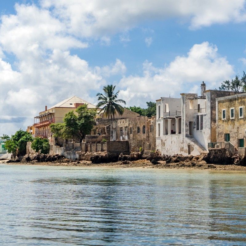 Ilha de Moçambique is captured in this evocative travel photograph from the sea, showcasing the historic island rising gently from the turquoise waters of the Indian Ocean. From this vantage point, the island’s whitewashed buildings, colonial architecture, and iconic forts form a striking contrast against the blue horizon and open sky. Traditional boats glide across the water, adding a timeless sense of movement and local life to the scene. The photograph conveys history, culture, and coastal beauty, highlighting Ilha de Moçambique as a UNESCO World Heritage Site where centuries of maritime heritage and island charm meet. Inspiration Africa specializes in bespoke, tailor-made journeys to Mozambique and across Africa, crafting unforgettable travel experiences in extraordinary destinations.
