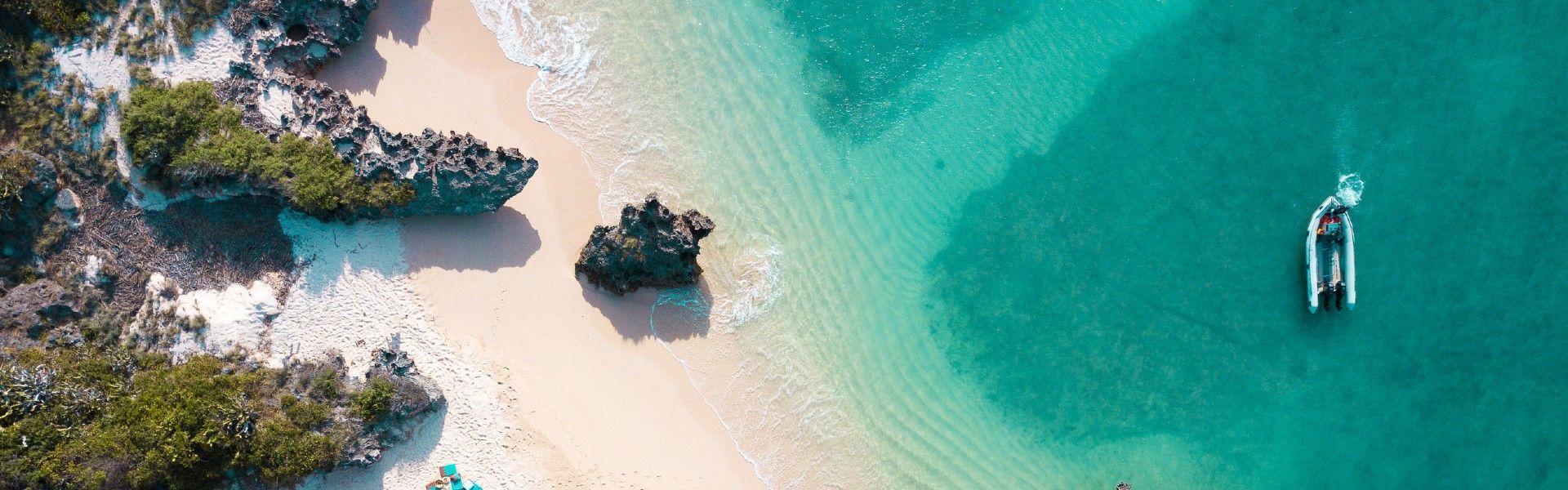 An aerial view of Memba Bay reveals a remote tropical coastline where turquoise waters meet untouched white sand beaches and rugged rock formations along the shores of northern Mozambique. The crystal-clear Indian Ocean, gentle waves, and secluded natural setting create a breathtaking landscape that captures the peaceful beauty and exclusivity of this hidden coastal paradise. Surrounded by pristine marine environments and unspoiled scenery, Memba Bay offers travelers an authentic escape into one of Africa’s most beautiful and lesser-known beach destinations. Inspiration Africa specializes in bespoke, tailor-made journeys across Mozambique and the African continent, designing immersive travel experiences that combine extraordinary landscapes, luxury escapes, and authentic cultural discovery. From remote island retreats to unforgettable safari adventures, every itinerary is carefully curated to showcase the beauty, diversity, and spirit of Africa.