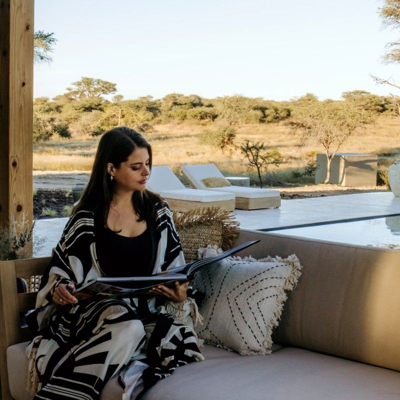 The bathroom at Otijwa Mountain Lodge in Namibia is captured in this elegant travel photograph, showcasing a luxurious and serene space designed to complement the surrounding wilderness. Natural materials, warm earthy tones, and modern fixtures create a sense of comfort and sophistication, while large windows or open layouts allow light to flood the space and offer sweeping views of the surrounding savannah and distant hills. The design balances contemporary luxury with a deep connection to nature, providing guests with a private and tranquil retreat. Ideal for luxury travelers, safari enthusiasts, and those seeking relaxation immersed in the African wilderness, this scene captures the elegance, serenity, and immersive experience that define Otijwa Mountain Lodge. Inspiration Africa specializes in bespoke, tailor-made journeys to Namibia and across Africa, crafting unforgettable lodge stays and extraordinary safari experiences.
