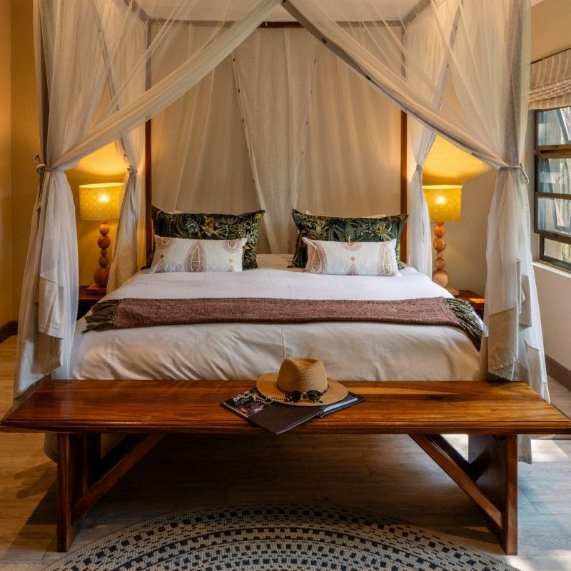 One of the beautifully appointed bedrooms at Onguma Bush Camp in Namibia is captured in this inviting travel photograph, showcasing a harmonious blend of comfort, elegance, and immersion in the African wilderness. Warm earthy tones, natural materials, and thoughtful décor create a serene and stylish retreat, while large windows and private terraces frame sweeping views of the surrounding savannah and distant wildlife. The room reflects the camp’s commitment to providing a luxurious yet authentic safari experience, allowing guests to relax in comfort while staying connected to nature. Ideal for safari enthusiasts, photographers, and travelers seeking tranquility, this scene captures the elegance, intimacy, and immersive charm that define Onguma Bush Camp. Inspiration Africa specializes in bespoke, tailor-made journeys to Namibia and across Africa, crafting unforgettable safari stays and extraordinary lodge experiences in exceptional landscapes.
