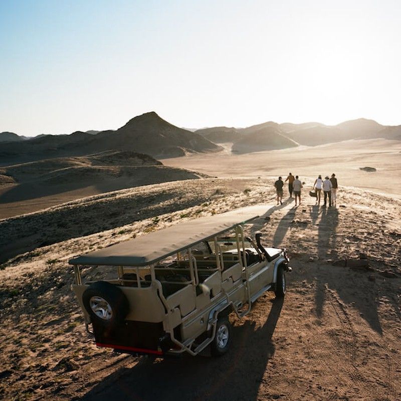 Enjoy a sunset drive in a jeep with time for a  sundowner drink set in the surreal and remote Kaokoland of northwest Namibia.