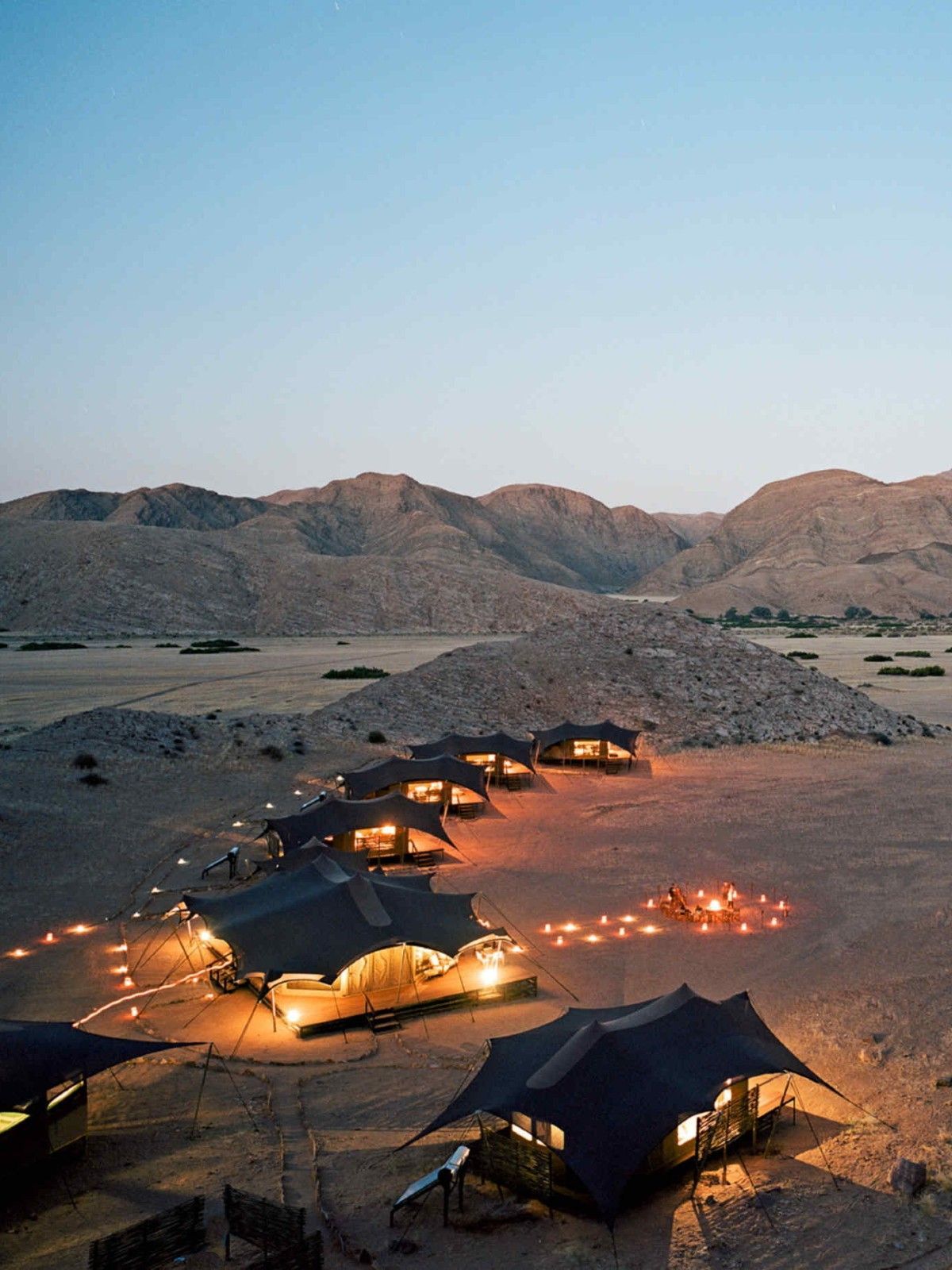 Sunset over the Hoanib Valley Camp, this beautiful eco-camp overlooks the Hoanib River Valley that runs through Namibia's remote Koakoveld.
