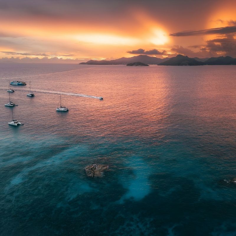 Island cruising in the Seychelles, whether by yacht or sailboat, offers an unforgettable way to experience the archipelago's beauty. Navigating between islands like Mahé, Praslin, and La Digue, travelers can access secluded beaches, hidden coves, and vibrant coral reefs.