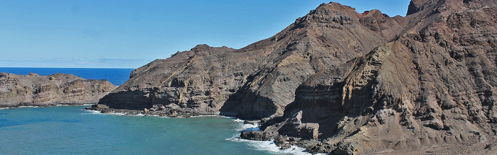 Sandy Bay is a remote, rugged coastal area on St. Helena Island, characterised by volcanic rock formations, dramatic cliffs, and black sand beaches. It offers stunning views, hiking opportunities, and a sense of solitude in a striking natural landscape.