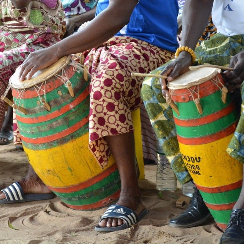 Traditional drum players in Togo, surrounded by the energy of color, rhythm, and movement—a vivid expression of the country’s rich cultural heritage. Drumming is central to many ceremonies and festivals in Togo, symbolizing unity, storytelling, and celebration. The vibrant attire and spirited performance reflect the depth and diversity of Togolese traditions, passed down through generations. Inspiration Africa organizes immersive travel to Togo, offering authentic encounters with music, dance, and daily life. Experience the heartbeat of West Africa through tailor-made journeys that connect you to the rhythm, culture, and warmth of this remarkable destination.