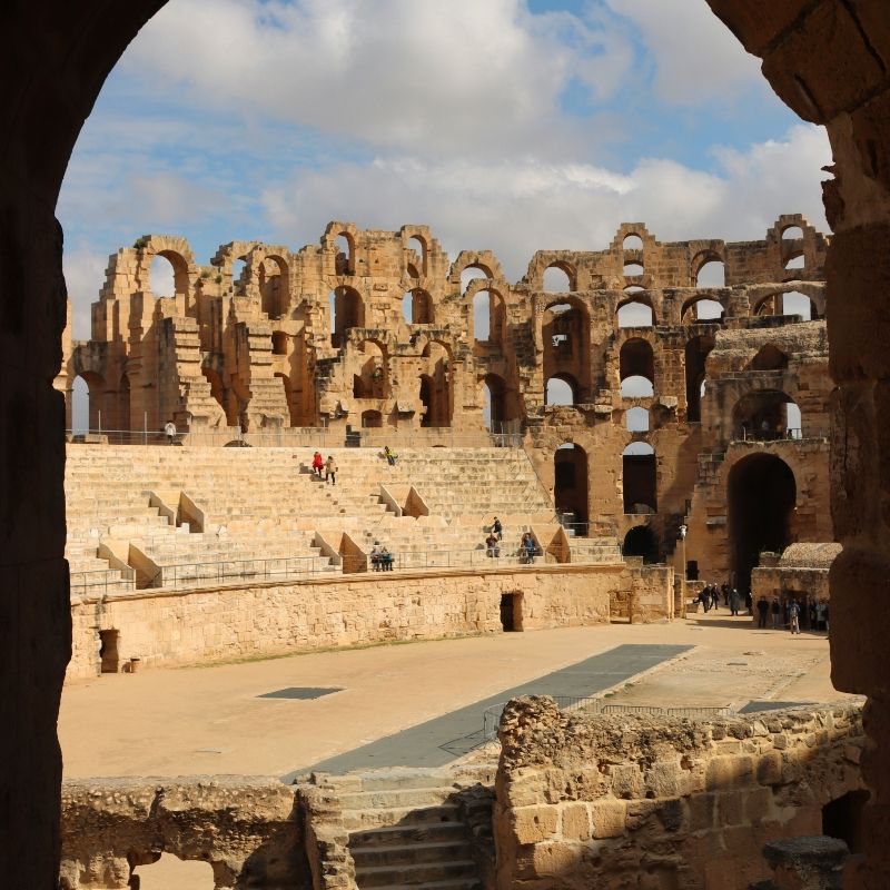 The magnificent El Djem Amphitheater in Tunisia is captured in this striking travel photograph, showcasing one of the largest and best-preserved Roman colosseums in the world. Built in the 3rd century AD, the arena’s towering stone walls, arches, and tiered seating reflect the architectural mastery and grandeur of ancient Roman civilization in North Africa. Once a venue for gladiatorial contests and public spectacles, El Djem today offers visitors a remarkable glimpse into Tunisia’s rich historical and cultural heritage. Ideal for history enthusiasts, culture lovers, and photographers, the amphitheater embodies the scale, elegance, and enduring legacy of the Roman Empire. Inspiration Africa specializes in bespoke, tailor-made journeys to Tunisia and across Africa, creating authentic travel experiences that bring extraordinary historical landmarks to life.