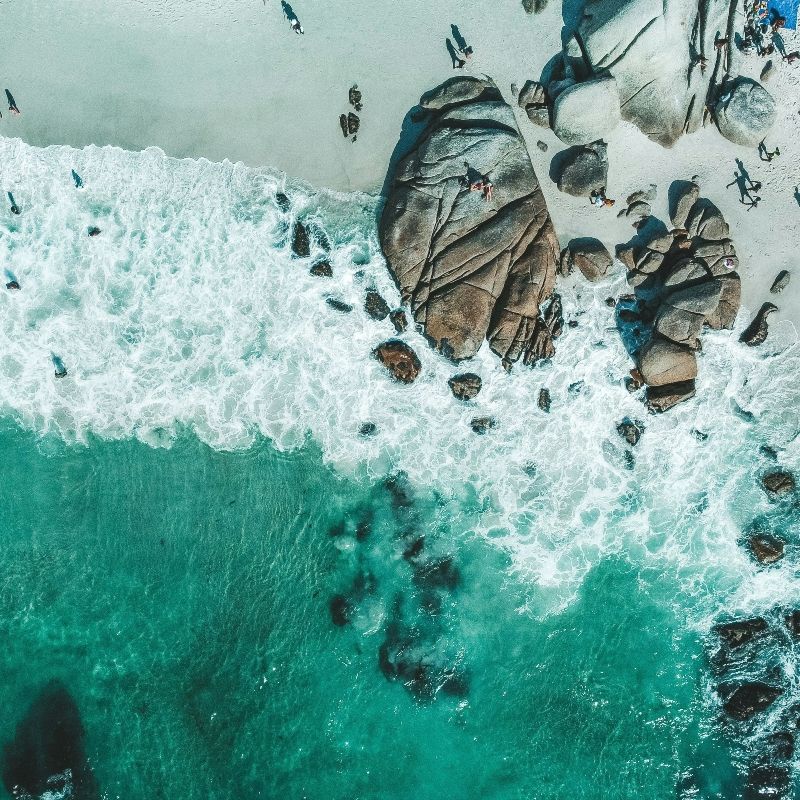 Experience the dramatic beauty of South Africa’s coastline with this stunning aerial image of Cape Point. The photo captures rugged cliffs plunging into the deep blue ocean, with waves crashing against the rocky shoreline, highlighting the raw power and striking contrasts of this iconic landscape. The sweeping view showcases Cape Point’s breathtaking scenery, where dramatic rock formations meet the vastness of the Atlantic, offering a sense of awe and serenity.
Inspiration Africa crafts tailor-made journeys to South Africa, providing travellers the opportunity to explore Cape Point, witness its spectacular coastal landscapes, and immerse themselves in one of the country’s most iconic and scenic destinations.
