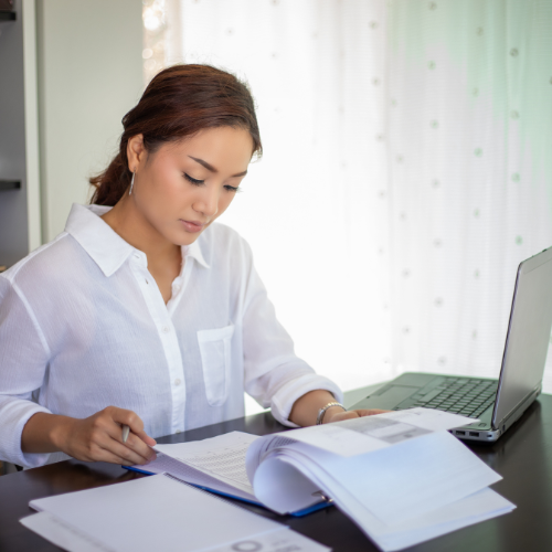 Woman preparing business taxes in Blaine Minnesota