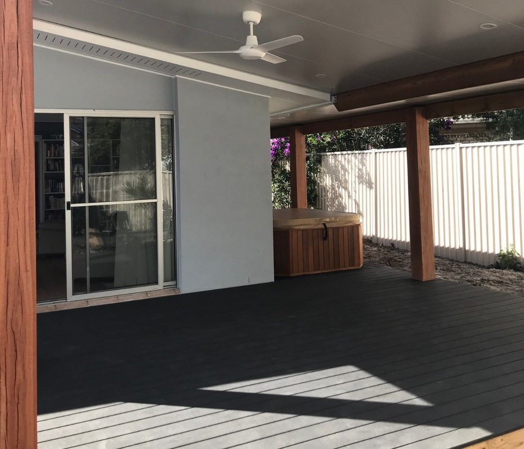 A Patio With A Ceiling Fan And A Sliding Glass Door — Joyner Electrical Pty Ltd In Ashmore, QLD