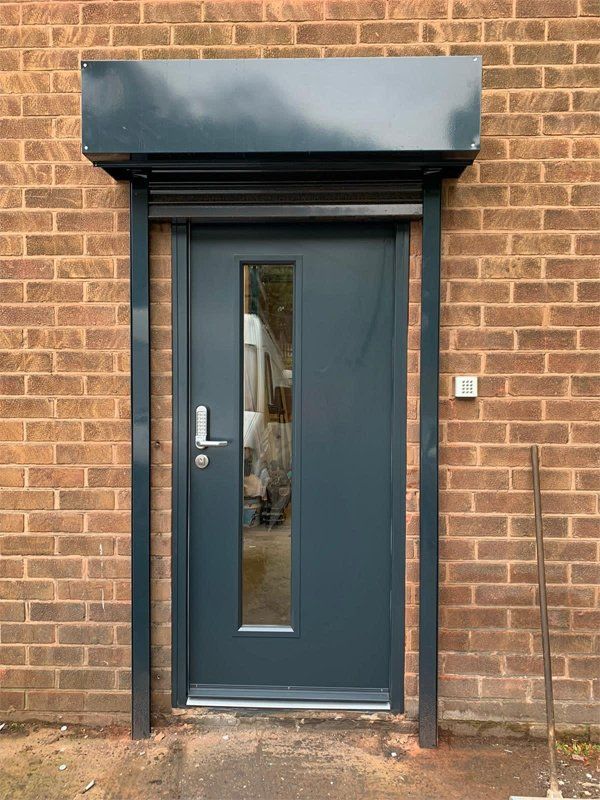 Small standard grey door with glass window inset