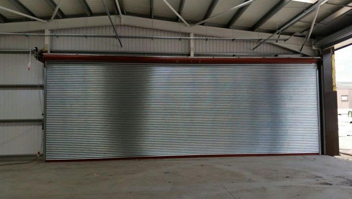 Silver roller shutter doors