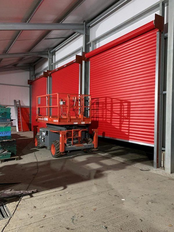 Three red roller shutter doors