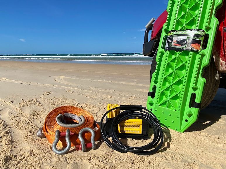 Recovery Gear Set With a Green Traction Board, Orange Tow Strap, and a Black Power Control Unit — Rainbow Beach 4x4 Accessories in Rainbow Beach, QLD