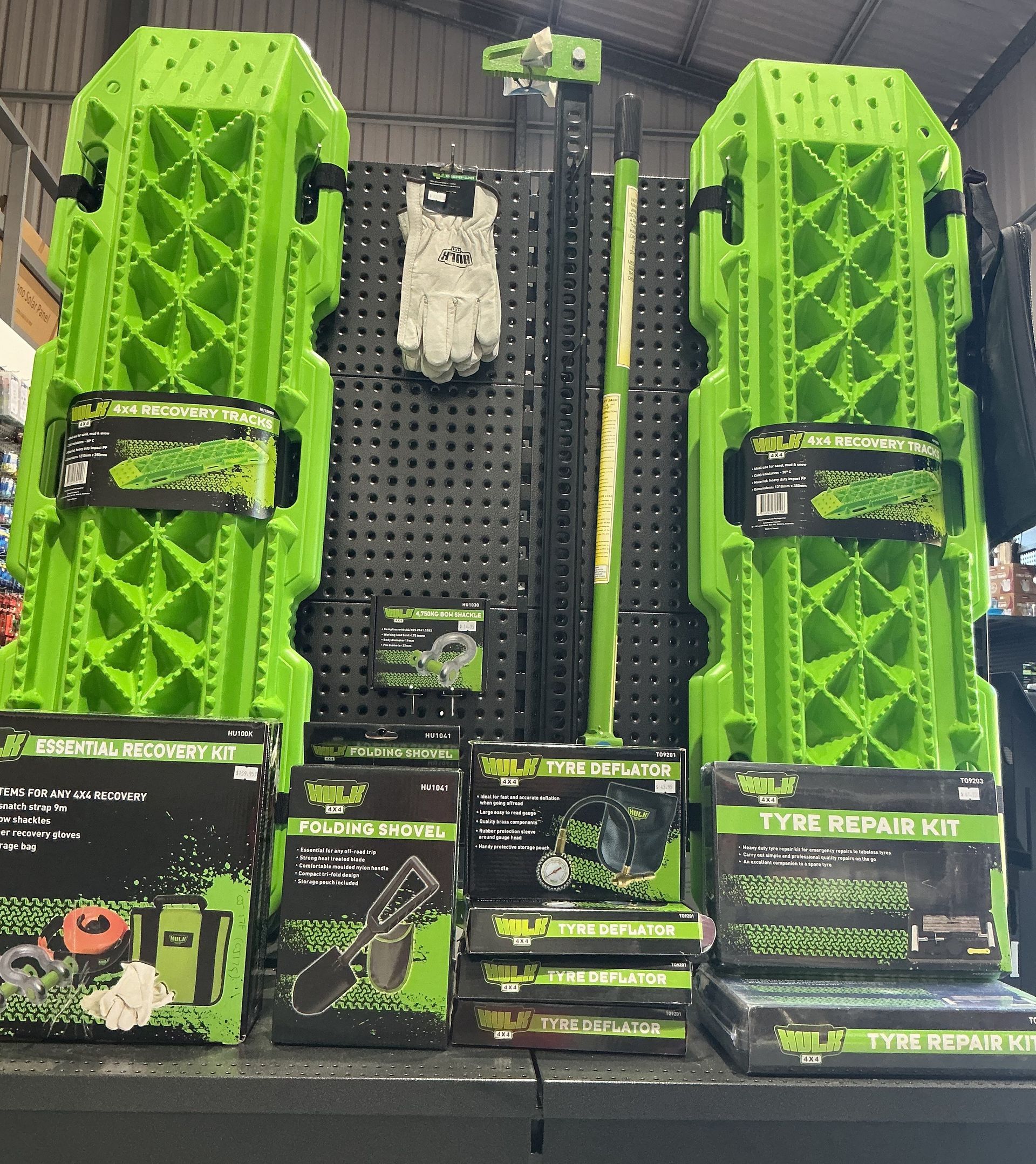 A Bunch of Green Boxes Are Sitting on a Shelf in a Store — Rainbow Beach 4x4 Accessories in Rainbow Beach, QLD