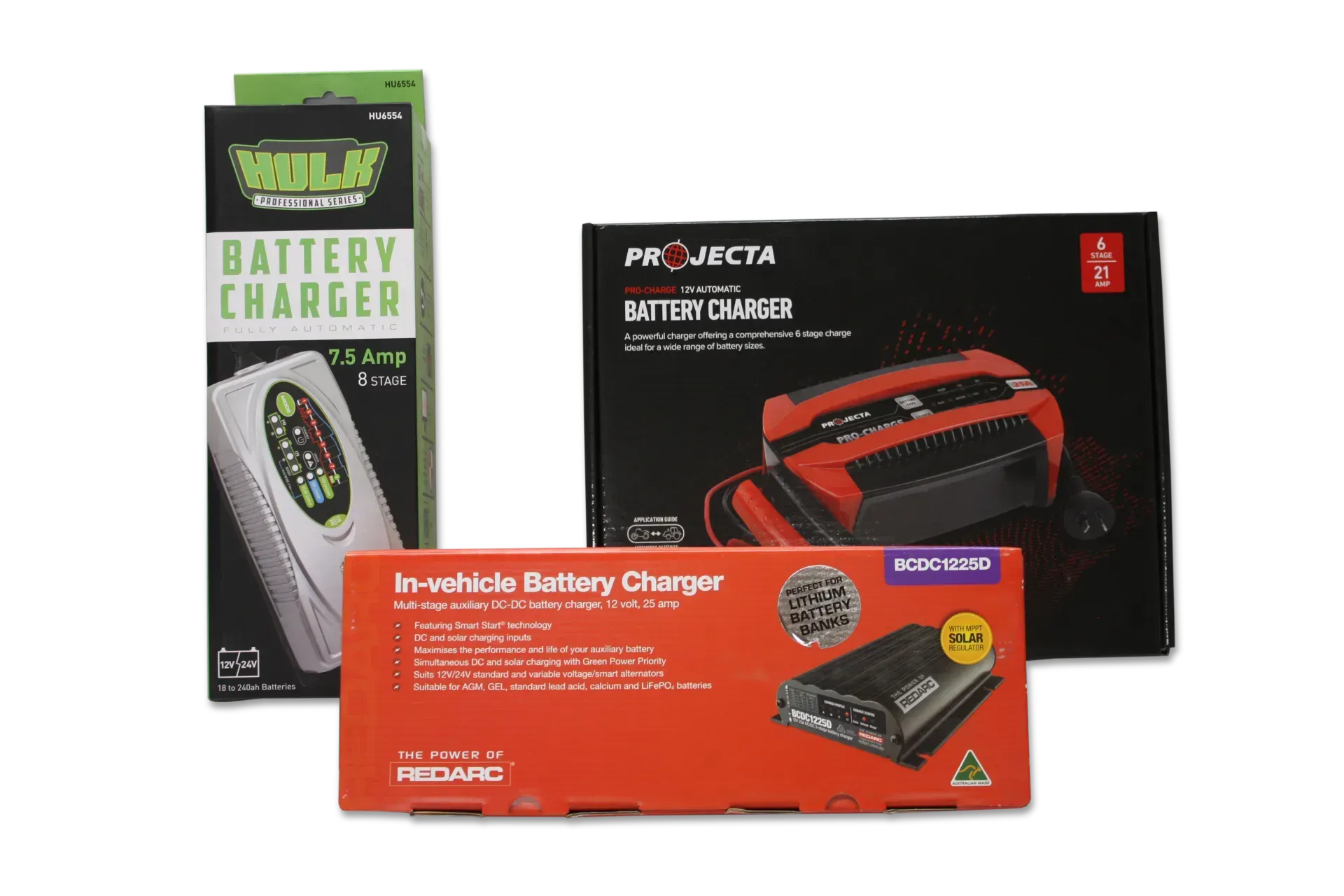 Three Boxed Car Battery Chargers of Different Sizes and Colors — Rainbow Beach 4x4 Accessories in Rainbow Beach, QLD