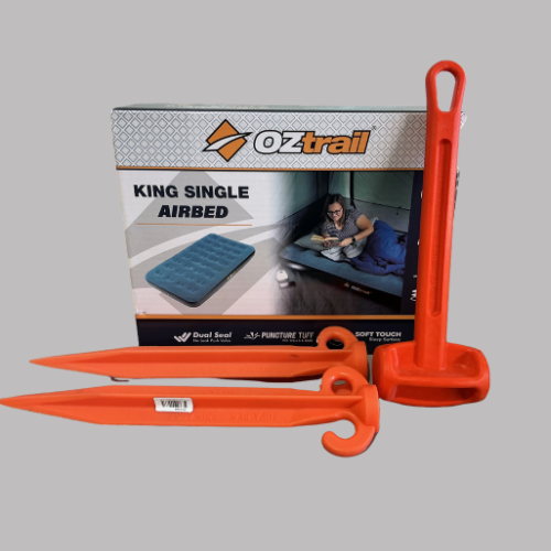 Orange tent pegs and a box for an OzTrail King Single airbed.— Rainbow Beach 4x4 Accessories in Rainbow Beach, QLD