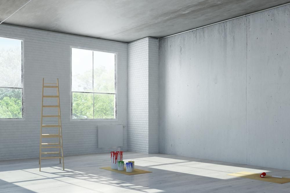 An Empty Room With a Ladder and Paint Buckets on the Floor — Tropical Coats Painting Whitsundays in Proserpine, QLD