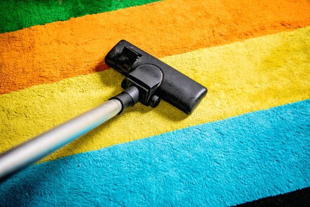 A Vacuum Cleaner is Cleaning a Colourful Carpet — Dunckers in Nambour, QLD