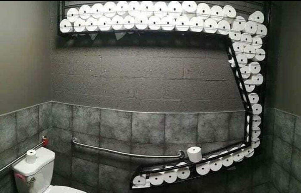 A Toilet in a Bathroom With Rolls of Toilet Paper on the Wall — Dunckers in Nambour, QLD