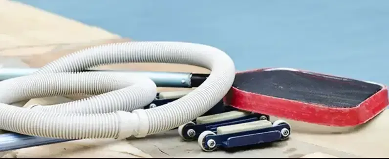 A Vacuum Hose and a Sponge are Sitting on a Table Next to a Pool — Dunckers in Nambour, QLD