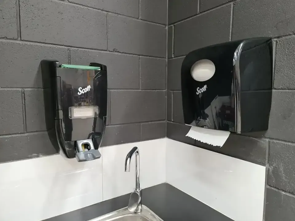 A Bathroom With a Sink, Toilet Paper Dispenser, and Soap Dispenser — Dunckers in Nambour, QLD