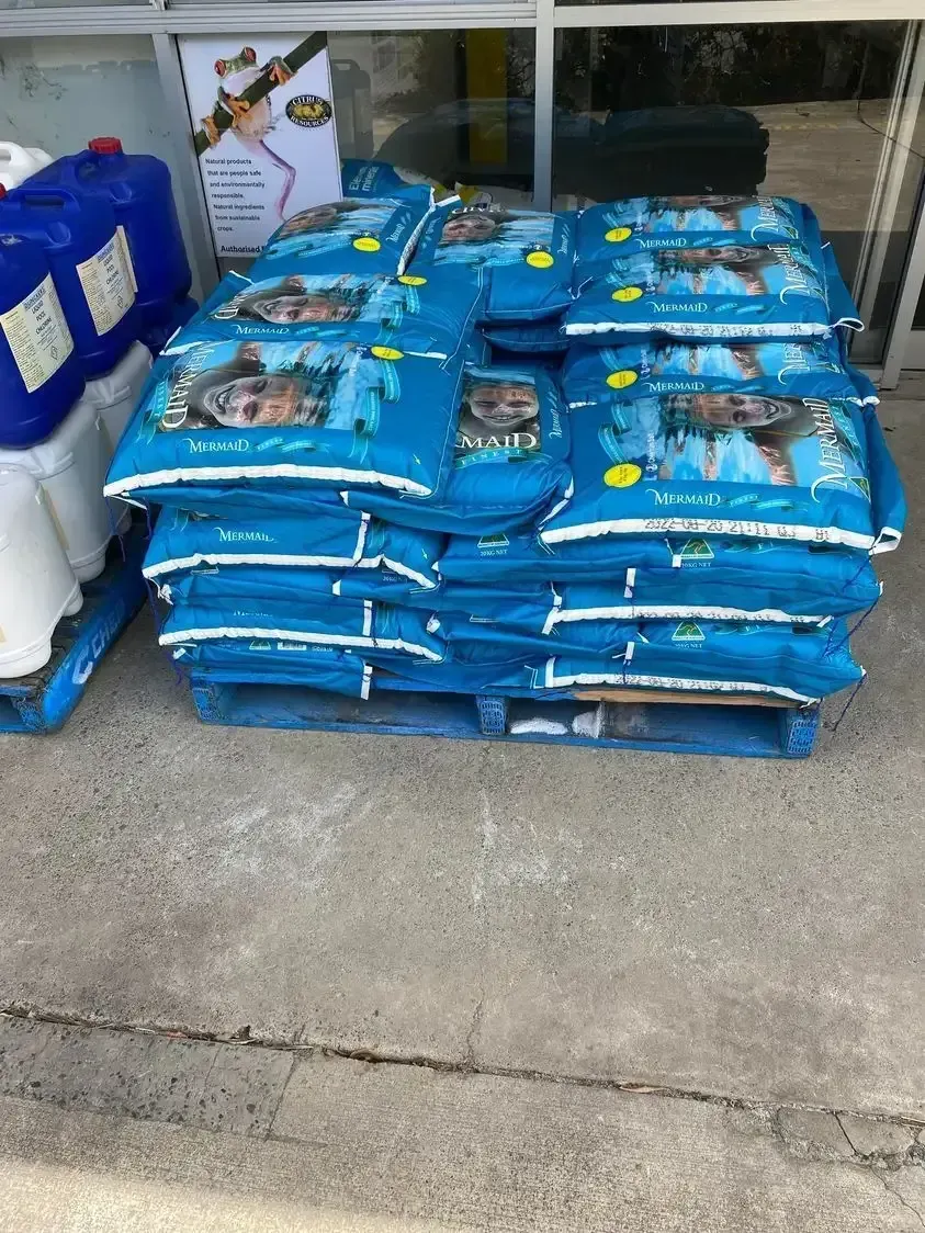 A Pile of Blue Bags Sitting on Top of a Wooden Pallet — Dunckers in Nambour, QLD