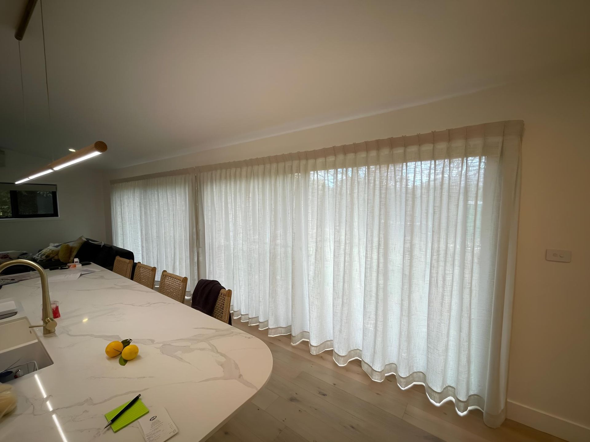 A Kitchen With a Large Table and Sliding Glass Doors — Elite Window Furnishings In Belconnen, ACT