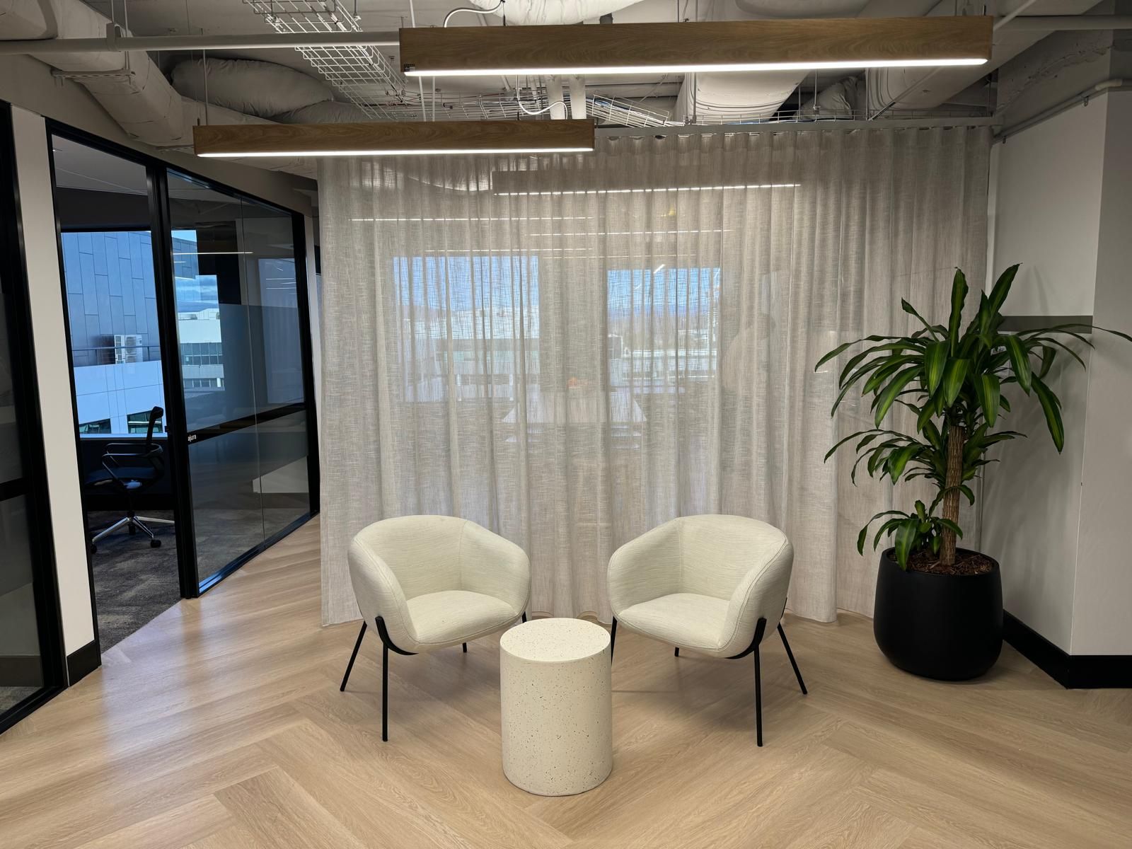 There are two chairs and a table in the room — Elite Window Furnishings In Fyshwick, ACT