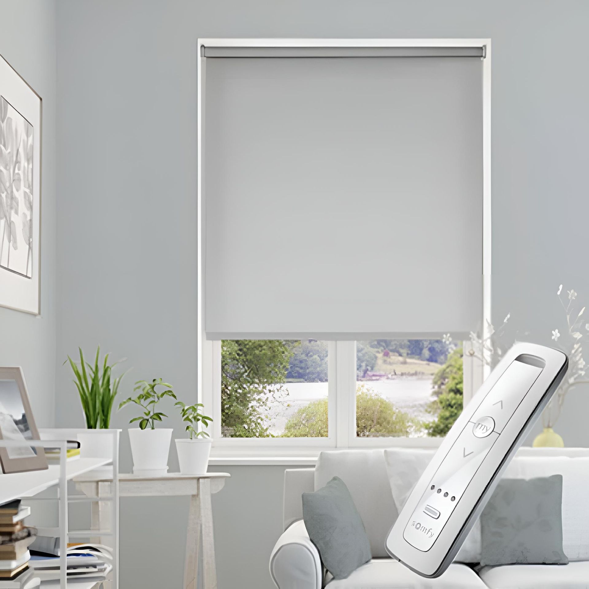 A Living Room With a Couch, Desk, Window and a Remote Control — Elite Window Furnishings In Fyshwick, ACT