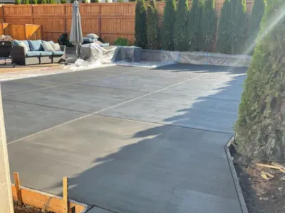 A concrete patio being built in a backyard in Salem, OR.