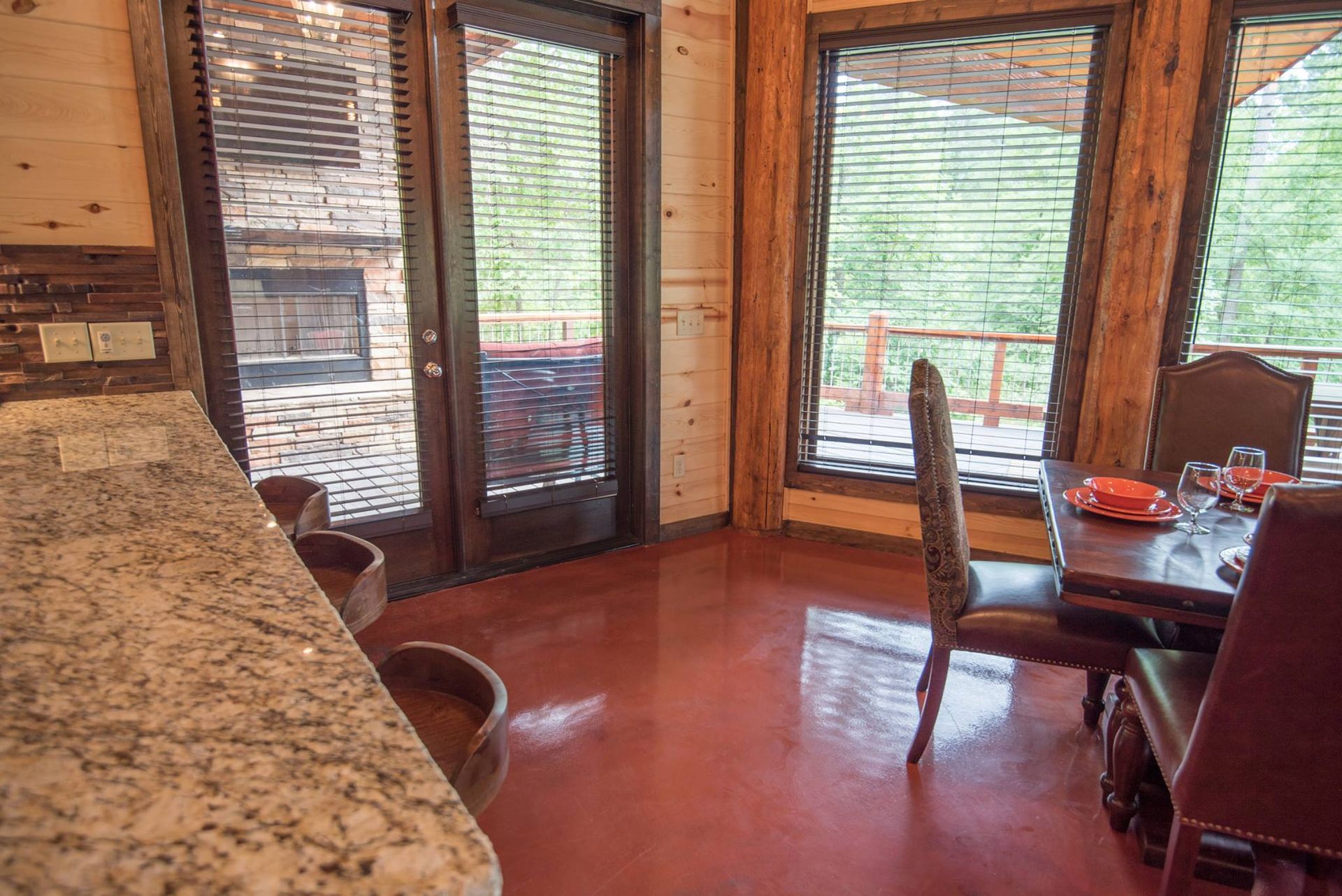 A dining room in a cabin with a table and chairs.