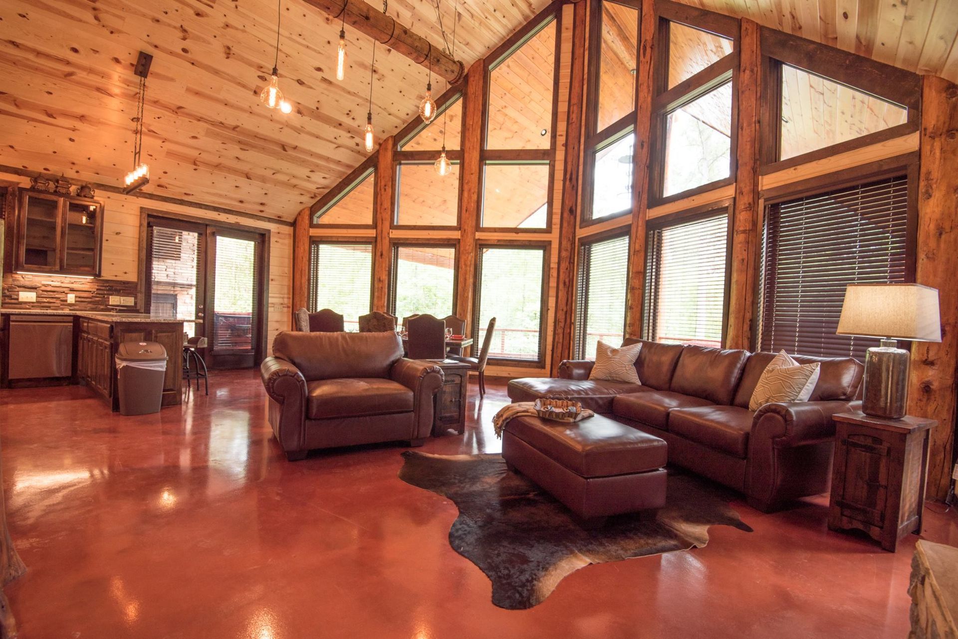 A living room filled with furniture and a lot of windows.