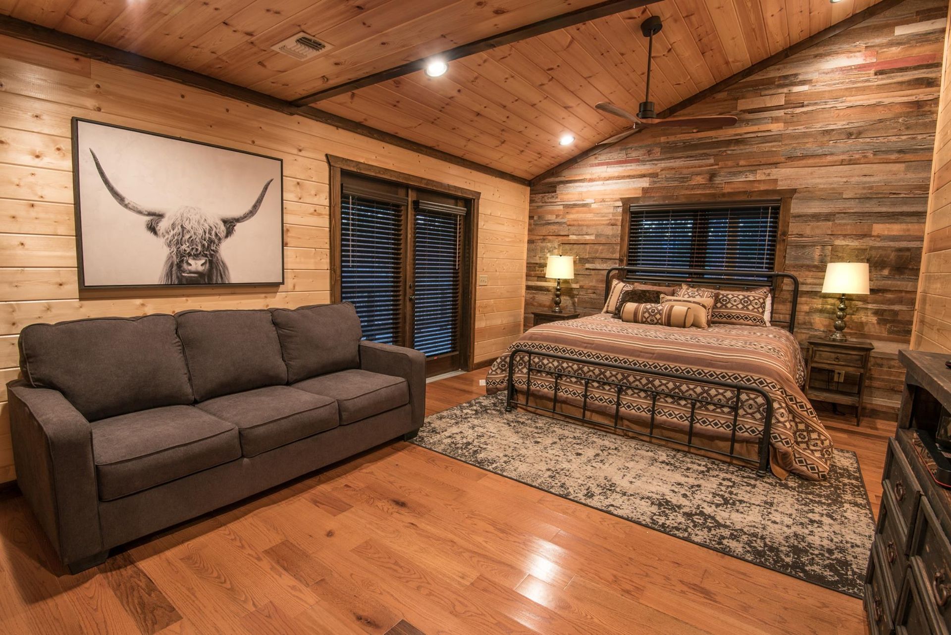 There is a couch and a bed in the room.