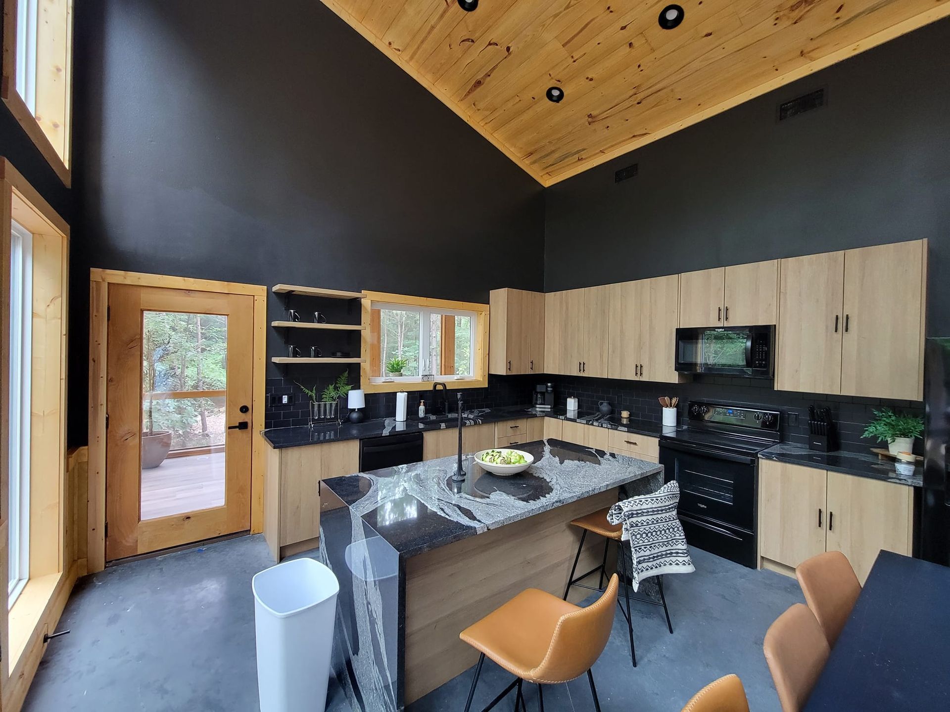 A kitchen with a large island in the middle of it