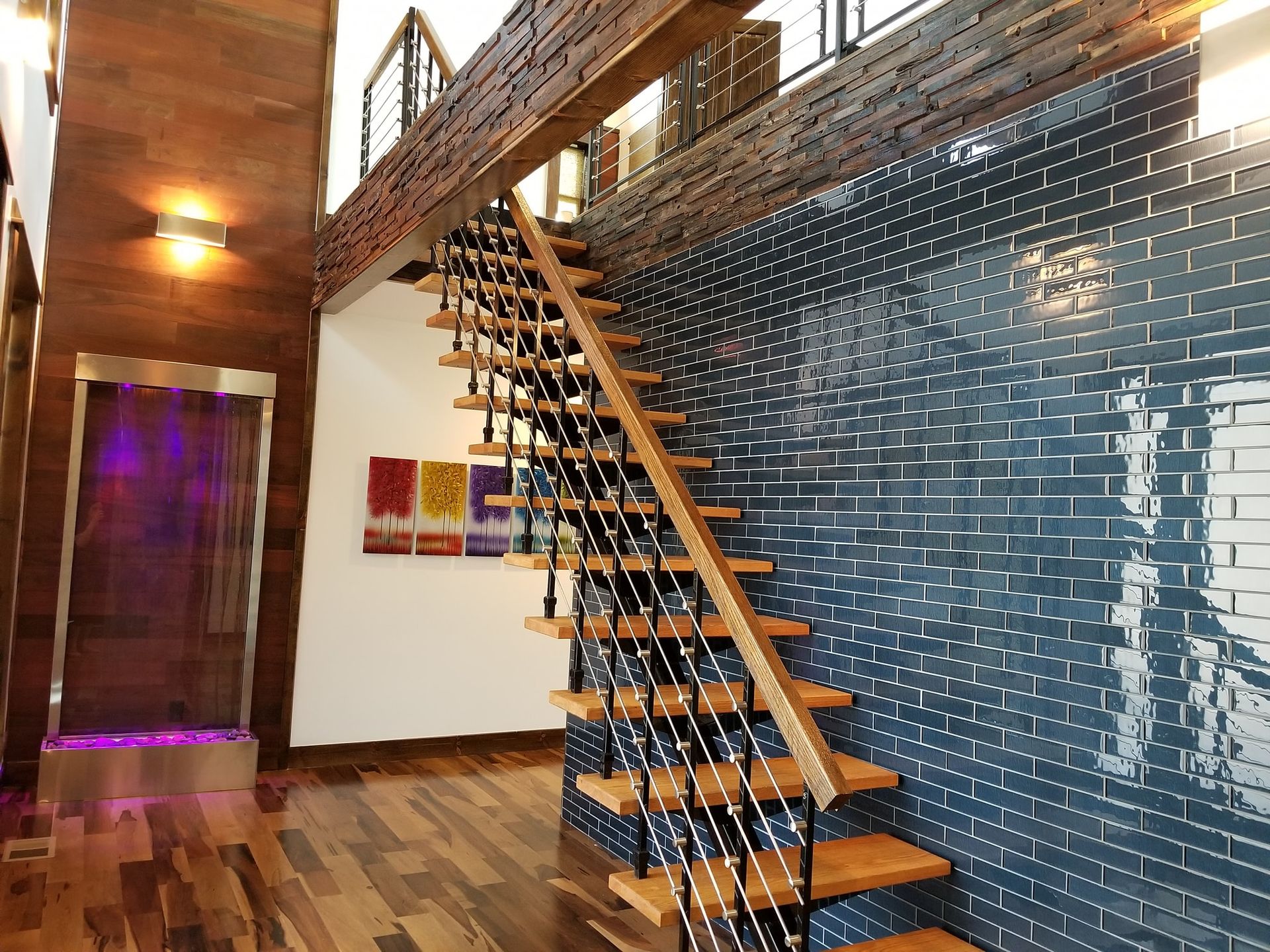 A wooden staircase leading up to the second floor of a house.
