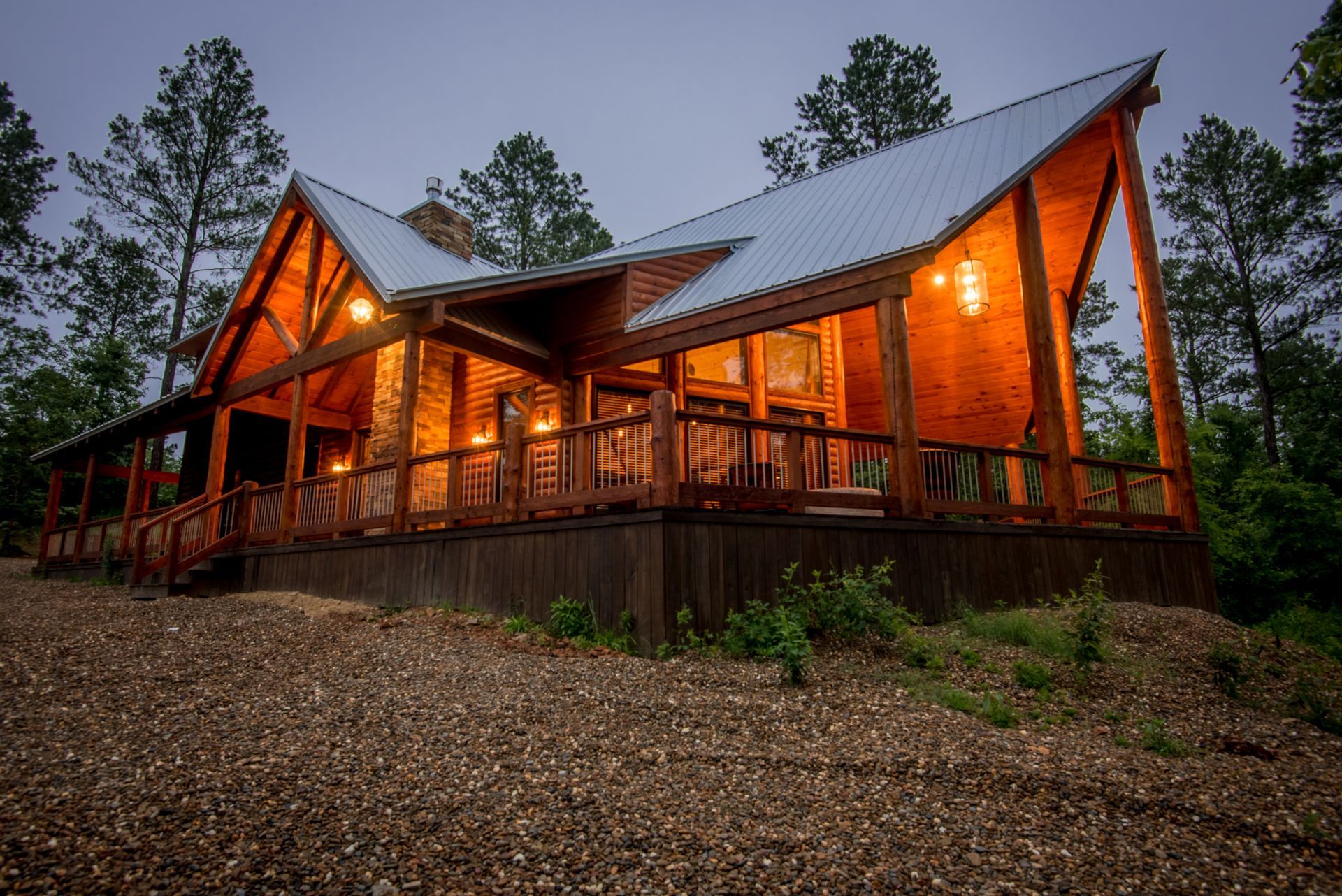 A wooden house is being built in the middle of a forest.