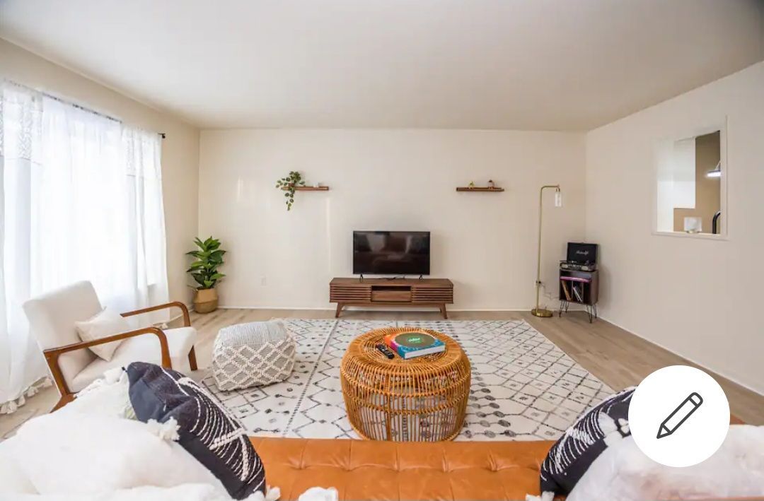 A living room filled with furniture and a flat screen tv.