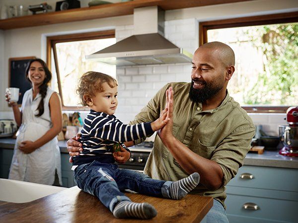 Father and Son Playing — Okeechobee, FL — Best Built Homes