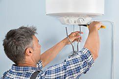 Plumber Installing Water Heater - Plumbing Service & Repair in Perkasie, PA