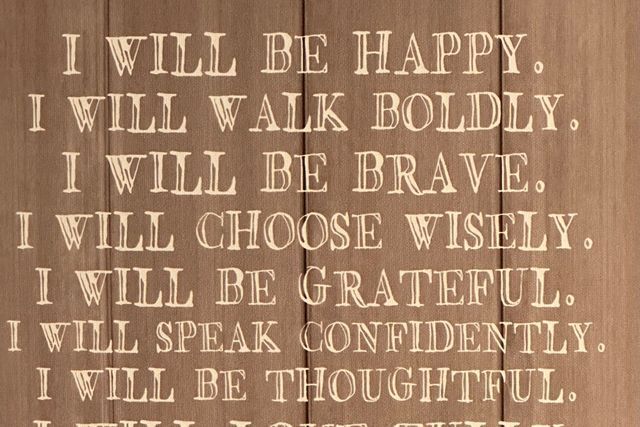 A wooden sign that says i will be happy