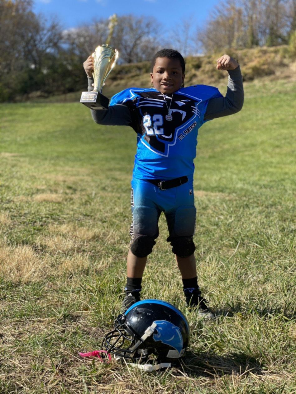 Player Proudly Holding Trophy — Florissant, MO — STL Panthers